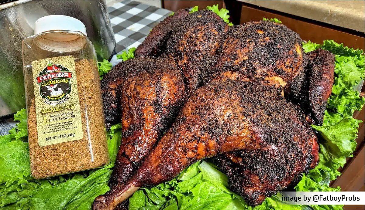 grilled whole chicken with a bottle of 25 oz cluckalicous