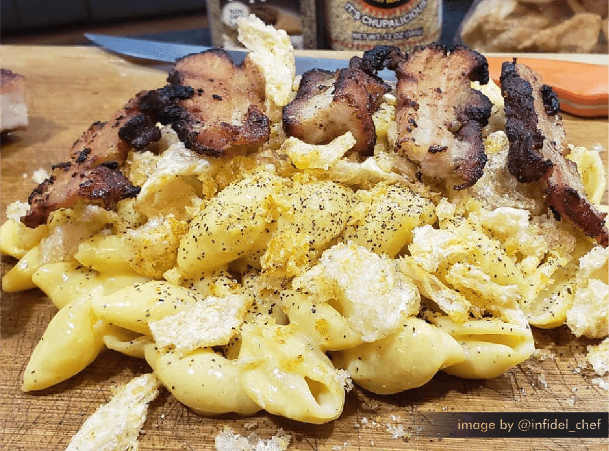 mac and cheese with bacon seasoned with cluckalicious