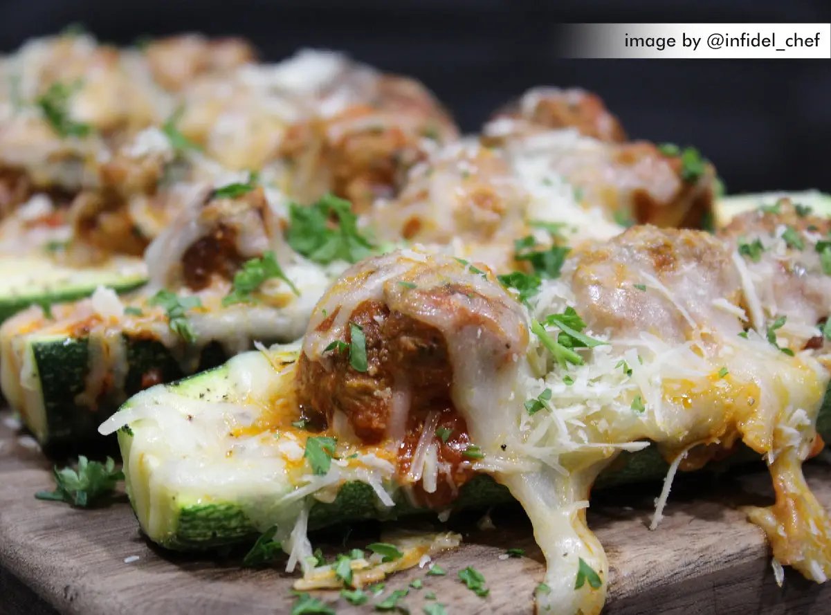 zucchini seasoned with Original without MSG topped with meatballs and cheese