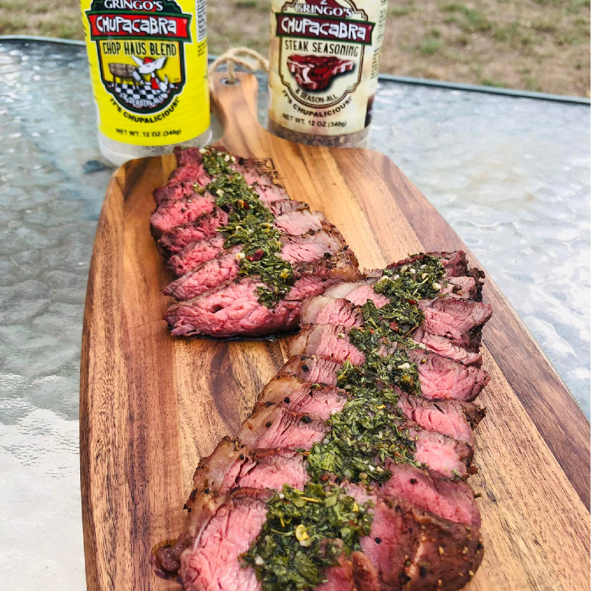 Cut up steak with steak seasoning and chop haus blend in the background