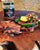 tray of fajitas with a jar of tomatillo salsa